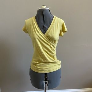 yellow v neck shirt